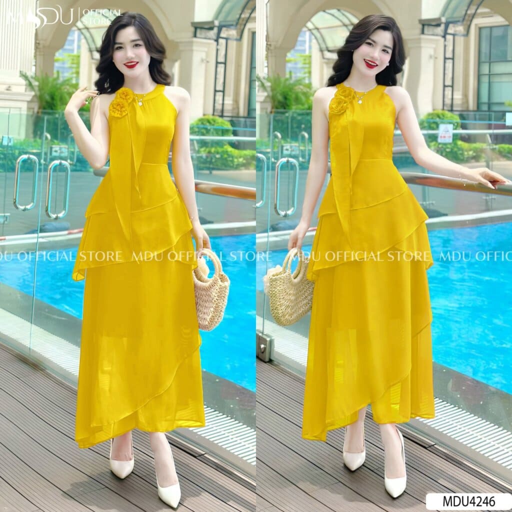 Đi Biển Mặc Gì Chụp Hình Đẹp? Mách Nàng Top Mẫu Váy Thiết Kế Hot Mùa Hè 2025 5 Đi biển mặc gì chụp hình đẹp - Váy màu vàng bắt mắt