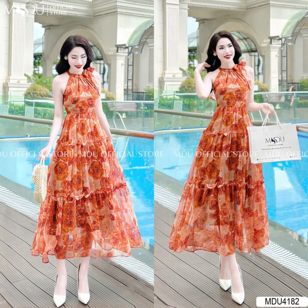 Xu Hướng Thời Trang Đi Biển Tuổi 40 Đẹp Hiện Đại Và Tự Tin 6 Thời trang đi biển tuổi 40 - Váy Đi Biển Cổ Yếm Tông Cam