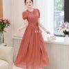 Váy Thiết Kế MDU5068 Tơ Óng Cam San Hô Duyên Dáng – Tay Bồng Nhẹ – Cổ Tròn Thanh Thoát – Hoa Đính Eo Lệch Nữ Tính