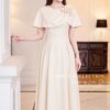 VÁY THIẾT KẾ MDU6841 – GOLD NHẬT GAM KEM CHOÀNG VAI THANH LỊCH 10 Dressing model in outfit 4K 202609091020 Mdu Fashion