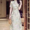 Váy Thiết Kế MDU6450 – Gấm Luxury Jacquard Kem Loang, Cổ Cao Đính Nơ Lớn Quý Phái 12 Changing fabric to match image 202608071528 1 11zon Mdu Fashion