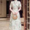 Váy Thiết Kế MDU6450 – Gấm Luxury Jacquard Kem Loang, Cổ Cao Đính Nơ Lớn Quý Phái 1 Changing fabric to match image 202608071528 2 11zon Mdu Fashion
