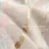 Váy Thiết Kế MDU6450 – Gấm Luxury Jacquard Kem Loang, Cổ Cao Đính Nơ Lớn Quý Phái 15 Macro photography of dress fabric 202608240834 11zon Mdu Fashion