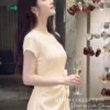 Váy Thiết Kế MDU6633 – Twist Satin Kem, Phối Hoa Thủ Công Đính Eo 11 Model in outfit close up 4K 202607151428 2 11zon Mdu Fashion