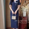 Set Thiết Kế MDU6740 – Tuytsi Xanh Than, Phối Hoa Cùng Tông Đính Liền 2 Model wearing midi skirt 4K 202608261113 11zon Mdu Fashion
